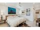 Bedroom with panelled walls, ceiling fan, and stylish decor at 2981 Teller St, Wheat Ridge, CO 80033