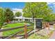 Landscaped front yard and a well-maintained exterior, complemented by a 'For Sale' sign at 2981 Teller St, Wheat Ridge, CO 80033