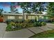 Charming single-story home featuring a beautifully landscaped front yard and modern architectural details at 2981 Teller St, Wheat Ridge, CO 80033