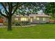 Attractive single-story house with lush green lawn, mature trees, and inviting front entrance at 2981 Teller St, Wheat Ridge, CO 80033