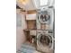Space-saving laundry room with stacked washer and dryer, along with a utility sink at 2981 Teller St, Wheat Ridge, CO 80033