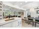 Bright open-concept living room with modern fixtures and large tile floor at 2981 Teller St, Wheat Ridge, CO 80033