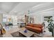 Bright and airy living room open to kitchen with stylish decor and modern finishes at 2981 Teller St, Wheat Ridge, CO 80033