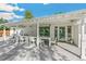 Outdoor dining area under a covered patio, perfect for entertaining near the backyard pool at 2981 Teller St, Wheat Ridge, CO 80033