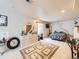 Large bedroom with neutral carpet, plenty of natural light, and ample closet space at 6154 Quitman St, Arvada, CO 80003