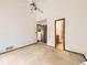 Bedroom with ensuite bathroom, neutral carpet, and plenty of natural light at 6154 Quitman St, Arvada, CO 80003