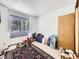 Simple room with a single window and a variety of household items at 6154 Quitman St, Arvada, CO 80003
