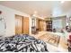 Spacious bedroom with a rug, large closet, ample light, and neutral walls and carpet at 6154 Quitman St, Arvada, CO 80003