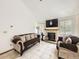 Spacious living room with fireplace, vaulted ceiling, and tile flooring at 6154 Quitman St, Arvada, CO 80003