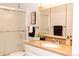 Bathroom featuring a vanity with a sink, a mirror, and a glass shower at 9155 E Center Ave # 1A, Denver, CO 80247