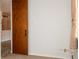 Bedroom featuring a closet, window, and neutral-toned walls and carpet at 9155 E Center Ave # 1A, Denver, CO 80247