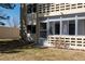 Exterior view of the condo building with a private walkout patio at 9155 E Center Ave # 1A, Denver, CO 80247