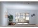 Inviting living room with bright, natural light and neutral carpet at 9155 E Center Ave # 1A, Denver, CO 80247