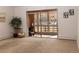 Living room area with access to an enclosed outdoor patio at 9155 E Center Ave # 1A, Denver, CO 80247
