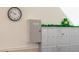 Mailboxes with a realtors lock box in a well lit hallway with a decorative clover at 9155 E Center Ave # 1A, Denver, CO 80247