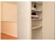 Hallway with shelves and storage space, next to wood-floored area at 9155 E Center Ave # 1A, Denver, CO 80247