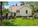 Backyard featuring a lawn, garden area, and outdoor seating at 5674 S Prescott St, Littleton, CO 80120