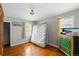 Bright bedroom with hardwood floors, plenty of natural light, and ample space for furnishings at 5674 S Prescott St, Littleton, CO 80120