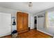 Bedroom featuring hardwood floors and a large armoire at 5674 S Prescott St, Littleton, CO 80120