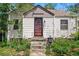 Welcoming single-Gathering home with tidy landscaping, enhancing curb appeal at 5674 S Prescott St, Littleton, CO 80120
