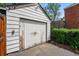 Exterior view of a detached garage with peeling paint, showing character and potential at 5674 S Prescott St, Littleton, CO 80120