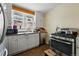Well-equipped kitchen features modern appliances and plenty of counter space for meal preparation at 5674 S Prescott St, Littleton, CO 80120