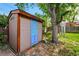 Charming backyard storage shed with colorful door adds character to the outdoor space at 5674 S Prescott St, Littleton, CO 80120