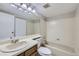 Well-lit bathroom with a combined tub and shower at 18193 E Kentucky Ave # 204, Aurora, CO 80017