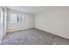 Comfortable bedroom with neutral carpet and a bright window at 18193 E Kentucky Ave # 204, Aurora, CO 80017