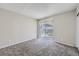 Bright bedroom featuring a sliding glass door to an outdoor space at 18193 E Kentucky Ave # 204, Aurora, CO 80017