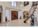 Stunning foyer with soaring ceilings, grand staircase and beautiful tile floor at 4681 S Columbine Ct, Cherry Hills Village, CO 80113