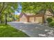 Spacious four-car garage with a basketball hoop, perfect for car enthusiasts and sports lovers at 4681 S Columbine Ct, Cherry Hills Village, CO 80113