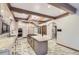 Bright kitchen featuring a large island, stainless appliances, and beautiful marble floors at 4681 S Columbine Ct, Cherry Hills Village, CO 80113