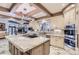 Spacious kitchen featuring granite countertops, stainless steel appliances, and a large island at 4681 S Columbine Ct, Cherry Hills Village, CO 80113