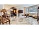Bright living room featuring large windows, marble floors, and a stylish curved couch at 4681 S Columbine Ct, Cherry Hills Village, CO 80113
