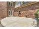 Spacious concrete patio with brick home exterior at 4681 S Columbine Ct, Cherry Hills Village, CO 80113