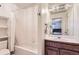 Clean bathroom with shower/tub combo and wood vanity at 4681 S Columbine Ct, Cherry Hills Village, CO 80113