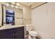 Basement bathroom with shower and dark vanity at 4681 S Columbine Ct, Cherry Hills Village, CO 80113