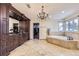 Luxurious bathroom with soaking tub, walk-in shower, and dual vanity at 4681 S Columbine Ct, Cherry Hills Village, CO 80113