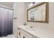 Bright bathroom with white vanity and ornate mirror at 4681 S Columbine Ct, Cherry Hills Village, CO 80113