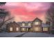 Brick two-story house with a three-car garage, nestled on a snow-covered lot at 4681 S Columbine Ct, Cherry Hills Village, CO 80113