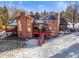 Brick house with large deck and backyard at 4681 S Columbine Ct, Cherry Hills Village, CO 80113