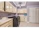 Laundry room with built-in cabinets and a sink at 4681 S Columbine Ct, Cherry Hills Village, CO 80113