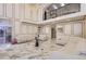 High-ceilinged living room with marble floors and white sofas at 4681 S Columbine Ct, Cherry Hills Village, CO 80113