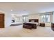 Spacious main bedroom with fireplace and large windows offering scenic views at 4681 S Columbine Ct, Cherry Hills Village, CO 80113