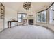 Bright sitting room featuring a fireplace and built-in shelving at 4681 S Columbine Ct, Cherry Hills Village, CO 80113