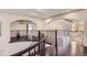 Elegant upper landing with curved staircase and wrought iron railing at 4681 S Columbine Ct, Cherry Hills Village, CO 80113