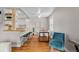 Sunlit dining area featuring hardwood floors, modern decor, and seamless connection to the adjacent kitchen at 2867 Jasmine St, Denver, CO 80207