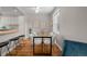 Bright dining area with hardwood floors, modern furnishings, and seamless access to the adjacent kitchen and living spaces at 2867 Jasmine St, Denver, CO 80207
