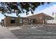 Modern brewery exterior with ample parking, providing a welcoming and accessible space for visitors at 2867 Jasmine St, Denver, CO 80207